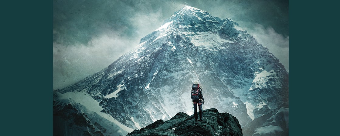 Image of climber looking at Mt. Everest in the distance