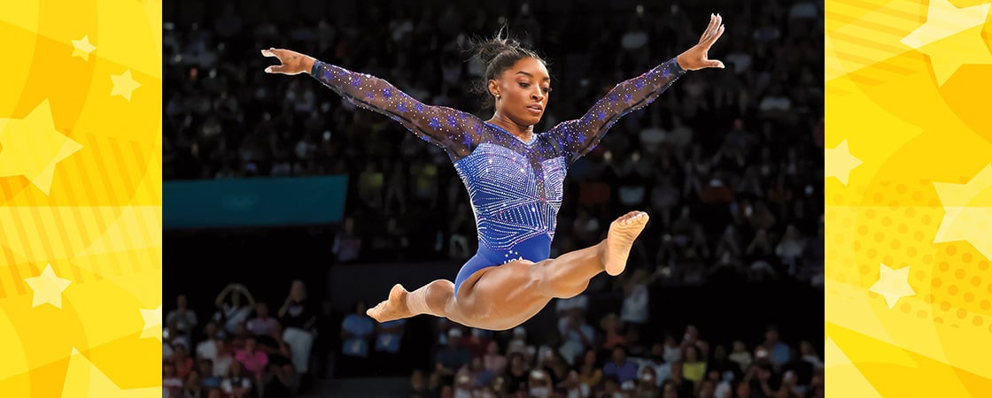 Image of Simone Biles performing a split in the air